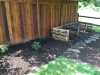 3-bin compost area and newly planted native rhododendrons